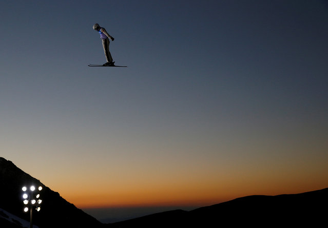 Qi Guangpu of China performs an aerial as he trains during the Snowboarding and Freestyle Skiing World Championships in Sierra Nevada, Spain, March 9, 2017. (Photo by Paul Hanna/Reuters)