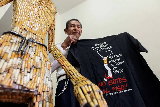 Ecuadorean Miguel Andagana shows puppets made of cigarette butts at his home in Puerto Ayora, in the Galapagos Islands September 9, 2016. Andagana is looking to be recognized in the Guinness Records as a one man program to eradicate cigarette butts from Puerto Ayora. (Photo by Guillermo Granja/Reuters)