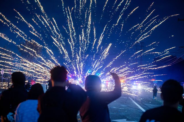 Law enforcement clashes with demonstrators during a protest following federal immigration operations, in the Compton neighborhood of Los Angeles, California on June 7, 2025. US President Donald Trump deployed 2,000 troops on June 7, 2025 to handle escalating protests against immigration enforcement raids in the Los Angeles area, a move the state's governor termed “purposefully inflammatory”. Federal agents clashed with angry crowds in a Los Angeles suburb as protests stretched into a second night Saturday, shooting flash-bang grenades and shutting part of a freeway amid raids on undocumented migrants, reports said. (Photo by Ringo Chiu/AFP Photo)