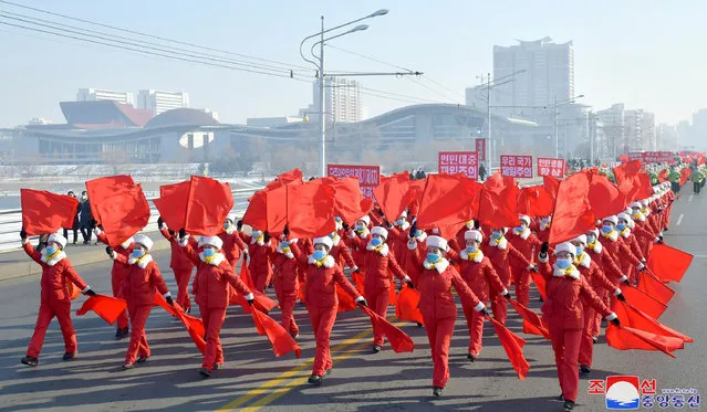 This picture taken on January 11, 2023 and released by North Korea's official Korean Central News Agency (KCNA) on January 12 shows members of the women's alliance holding a rally in Pyongyang to pledge to implement the decisions made at the 6th Plenary Meeting of the 8th Central Committee of the Workers' Party of Korea (WPK). (Photo by KCNA via KNS/AFP Photo)