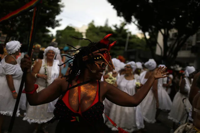 Revellers take part in the annual block party known as “Cordao do Boitata”, during carnival festivities in Rio de Janeiro, Brazil February 4, 2018. (Photo by Pilar Olivares/Reuters)