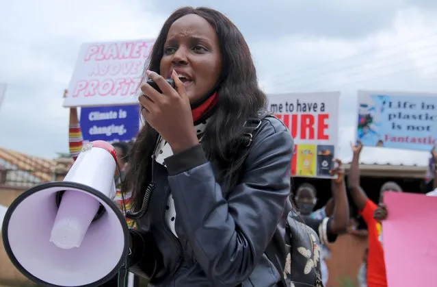 Ugandan climate change activist Vanessa Nakate, uses a megaphone with other activists holding placards advocating for climate change during a demonstration for the Global Climate Change in Luzira suburb of Kampala, Uganda on September 25, 2020. (Photo by Abubaker Lubowa/Reuters)