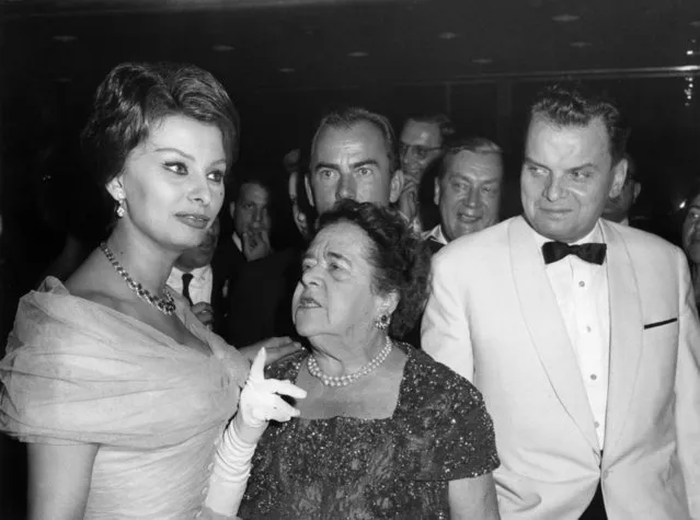 File picture taken on July 4, 1959 shows Italian actress Sophia Loren, American journalist Elsa Maxwell and festival director Dr. Alfred Bauer, right, talk at the festival in the Palais am Funkturm in Berlin. (Photo by Konrad Giehr/dpa via AP Photo/File)