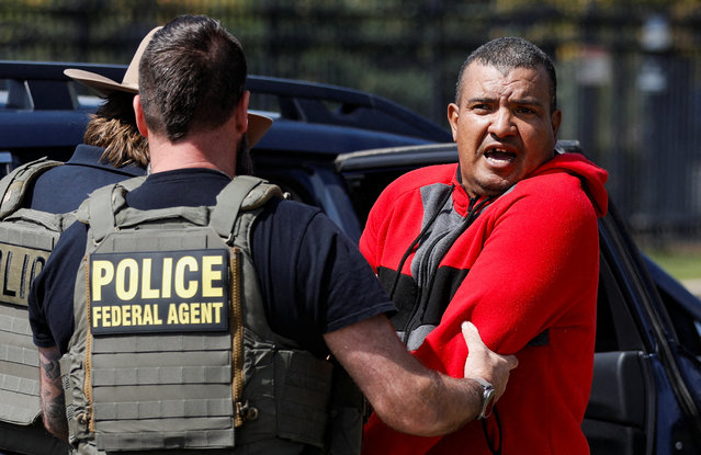A migrant reacts while federal agents from Immigration and Customs Enforcement (ICE) detain him near a Home Depot in the Little Village neighborhood in Chicago, Illinois on September 9, 2025. (Photo by Octavio Jones/Reuters)