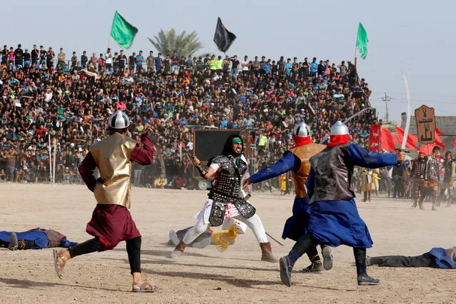 Local actors dressed as ancient warriors re-enact a scene from the 7th century battle of Kerbala during commemoration in Sadr City, Baghdad, Iraq October 12, 2016. (Photo by Ahmed Saad/Reuters)