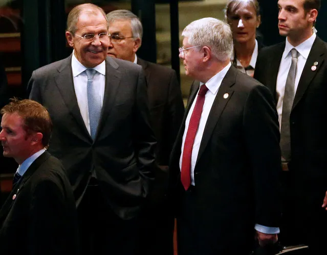 Russia's Foreign Minister Sergei Lavrov (L) reacts next to Russia's Ambassador to the U.N. Alexey Borodavkin after a round of Syria talks at the Beau-Rivage Palace in Lausanne, Switzerland, October 15, 2016. (Photo by Denis Balibouse/Reuters)