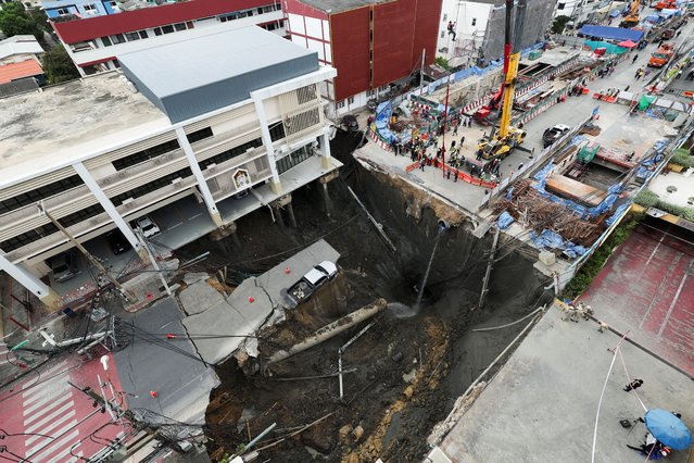 A massive sinkhole opens on Samsen Road near Vajira Hospital, in Bangkok, Thailand, on September 24, 2025. (Photo by Chalinee Thirasupa/Reuters)