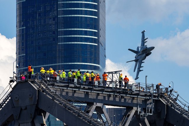 An EA-18G Growler flies over Brisbane City during a media preview of Riverfire in Brisbane, Australia, 05 September 2025. (Photo by Russell Freeman/EPA)