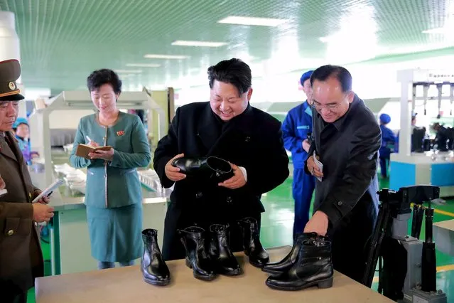 North Korean leader Kim Jong Un (2nd R) gives field guidance at the Wonsan Shoes Factory in this undated photo released by North Korea's Korean Central News Agency (KCNA) in Pyongyang November 27, 2015. (Photo by Reuters/KCNA)
