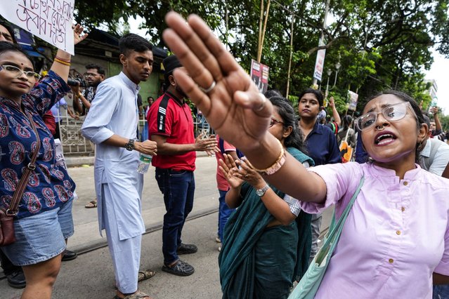 A woman shouts slogans as she joins a rally to protest against the rape and murder of a resident doctor at a government hospital in August, in Kolkata, India, Sunday, September 1, 2024. (Photo by Bikas Das/AP Photo)