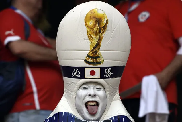 A disguised Japanese fan sticks out his tongue before the Russia 2018 World Cup Group H football match between Colombia and Japan at the Mordovia Arena in Saransk on June 19, 2018. (Photo by Juan Barreto/AFP Photo)