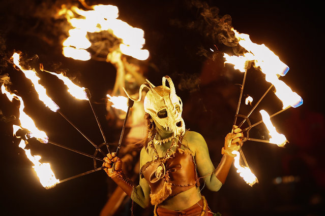 Performers take part in a procession as part of the Samhuinn Fire Festival on October 31, 2024 in Edinburgh, Scotland. The Samhuinn Fire Festival is a modern take on an ancient Celtic festival, marking the transition between summer and winter with fire-dancing, drums, acrobatics, and theatre performances. (Photo by Jeff J. Mitchell/Getty Images)