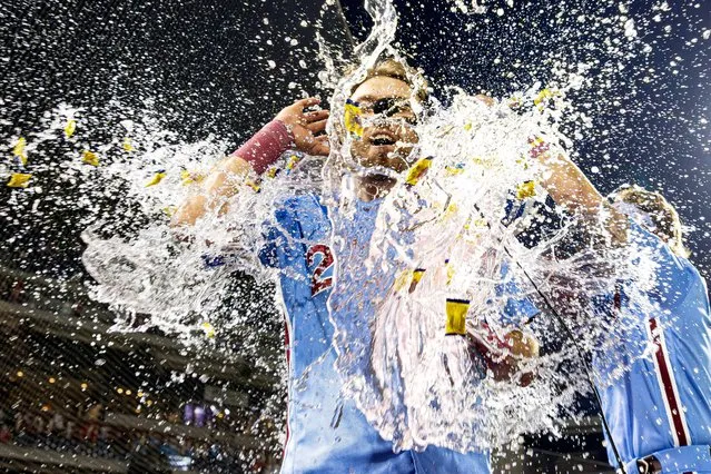 Philadelphia Phillies first baseman Kody Clemens (23) is doused by water after hitting a walk off game winning RBI single during the ninth inning against the Detroit Tigers at Citizens Bank Park in Philadelphia, Pennsylvania on June 8, 2023. (Photo by Bill Streicher/USA TODAY Sports)