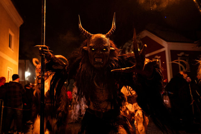 People dressed in costumes and masks participate in the traditional Perchten parade in Windischgarsten, Austria, on January 5, 2025. (Photo by Lisa Leutner/Reuters)