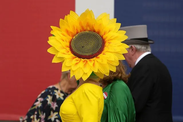Racegoers arrive for Ladies Day of the Royal Ascot horse racing meeting, at Ascot Racecourse in Ascot, England, Thursday, June 22, 2023. (Photo by Alastair Grant/AP Photo)