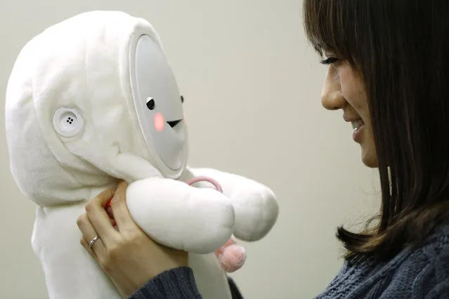 An employee demonstrates using the Smile Baby (Smiby) care robot, jointly developed by Togo Seisakusyo Corp. and Chukyo University, at Togo's headquarters in Togo Town, Aichi Prefecture, Japan, on Monday, January 26, 2015. The robot, aimed at an elderly market, went on sale on January 21 costing 68,000 yen ($777). (Photo by Bloomberg)
