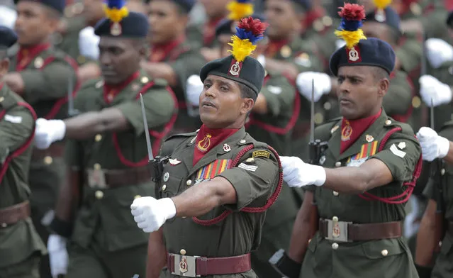 Sri Lankan army soldiers march during Independence Day celebrations in Colombo, Sri Lanka, Wednesday, Feb. 4, 2015. Sri Lanka has failed to heal its deep ethnic divide since the end of the nation's civil war five years ago, the president acknowledged Wednesday in a major speech calling for national reconciliation. (AP Photo/Eranga Jayawardena)