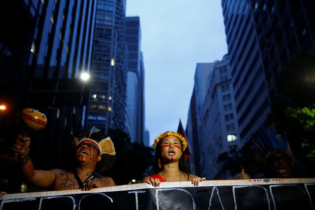 Indigenous people attend a demonstration against a constitutional amendment, known as PEC 55, that limits public spending, in Rio de Janeiro, Brazil November 25, 2016. (Photo by Rodrigo Garrido/Reuters)