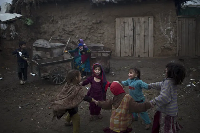 Afghan refugee girls play in a slum on the outskirts of Islamabad, Pakistan, Monday, February 2, 2015. (Photo by Muhammed Muheisen/AP Photo)
