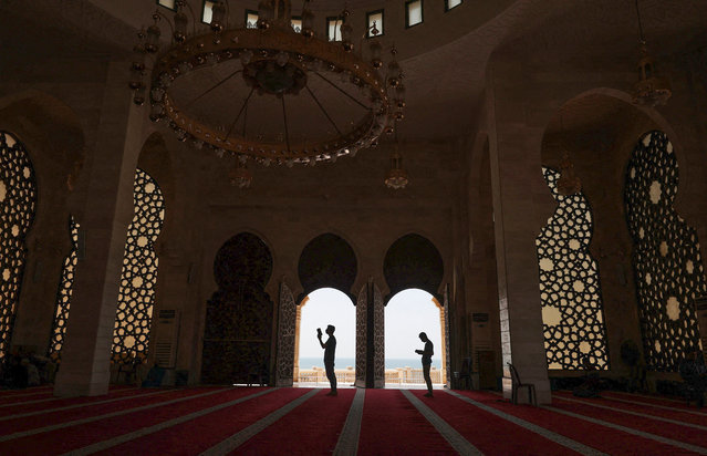 Muslim worshippers pray at Gaza City's Al-Khaledi Mosque on April 30, 2021, on the third Friday of the holy month of Ramadan, believed by Muslims to be the month when the holy book was first revealed to the Prophet Mohamed. (Photo by Mohammed Abed/AFP Photo)
