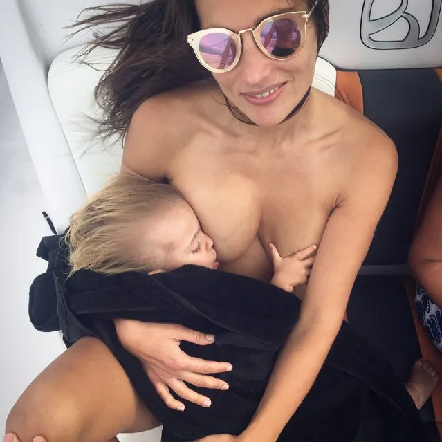 This lactivist proudly posts nude pictures of her breastfeeding her 34-month-old in defiance of haters who tell her she is disgusting and even accuse her of trying to steal their men by breastfeeding in public. A captivating picture shows photographer, Reka Nyari (39), who lives in New York, USA, breastfeeding her 34-month-old daughter, Ilo, while majestically sitting on a chair with an owl perched on her right arm. While another photo shows her lying next to her husband, Ian, and their dog while breastfeeding her daughter. Other shots show her lying on a sofa while breastfeeding her daughter when she was around two-years-old, and a black and white picture shows her breastfeeding in the nude. Reka has been breastfeeding her daughter since she was born in November 2015 and has never given her formula. She has always been an advocate for mums who choose to breastfeed their children beyond the age of one and insists that the natural practise is beneficial for the mother and child in the long term. Unapologetic, Reka, who is originally from Finland, chose to breastfeed her daughter anywhere she would want to be fed, including public places. With over 30K Instagram followers, she posts pictures of her breastfeeding on social media to educate the critics about the benefits of lactation. Here: Reka pictured breastfeeding Ilo. (Photo by Greg Gulbransen/MDWfeatures)