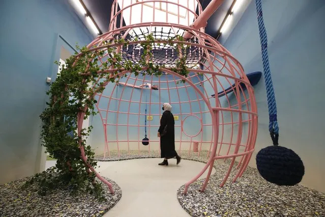 A woman visits Great Britain's pavilion during a press preview of the exhibition “How will we live together?”, at the Biennale International Architecture, in Venice, Italy Thursday, May 20, 2021. The 17th International Architecture Exhibition opens Saturday after a one-year pandemic delay, during which time architecture has emerged as one of the key disciplines in the global coronavirus response. (Photo by Alessandra Tarantino/AP Photo)