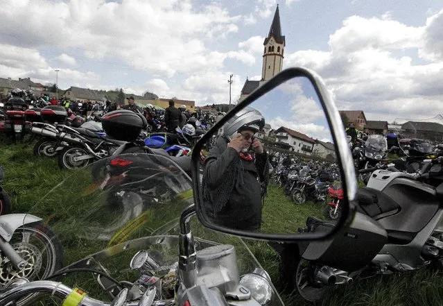 A motorist takes off his helmet during the first gathering of motorists at the beginning of the spring season in Mirna Pec April 6, 2015. (Photo by Srdjan Zivulovic/Reuters)