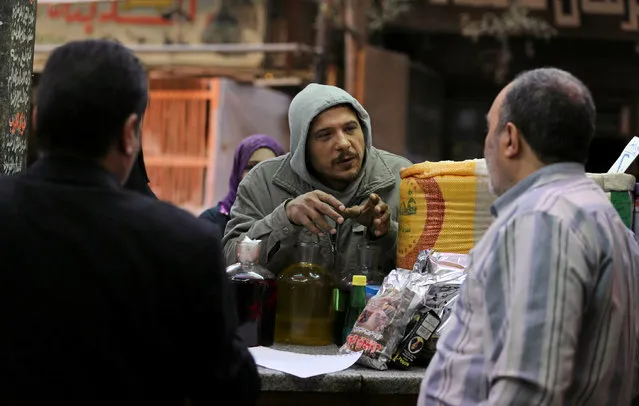 A customer explains his health issues as he asks for remedies at a herbal store in Cairo, Egypt January 10, 2017. (Photo by Mohamed Abd El Ghany/Reuters)