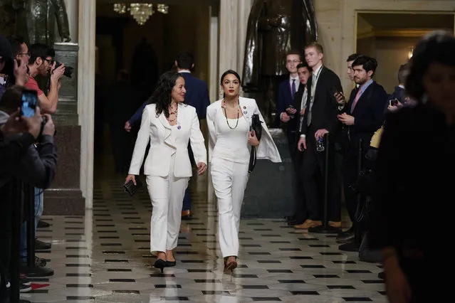 Rep. Alexandria Ocasio-Cortez, D-N.Y., right arrives with her guest, Ana Maria Archila of New York, N.Y., to hear President Donald Trump deliver his State of the Union address to a joint session of Congress on Capitol Hill in Washington, Tuesday, February 5, 2019. (Photo by Carolyn Kaster/AP Photo)