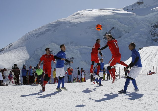 Amateur soccer players from Switzerland play against Italy during the Euro 2016 of the Mountain Villages soccer tournament on the Allalin glacier in Saas-Fee, Switzerland March 12, 2016. (Photo by Ruben Sprich/Reuters)