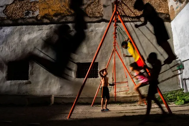 Street photography – winner – Childhood. Although teenagers’ lives appear completely absorbed by social media and the internet in many parts of the world, in Havana, Cuba, children still enjoy themselves by playing in the open air in their homes’ courtyards. (Photo by Lopamudra Talukdar/SIPA Contest)