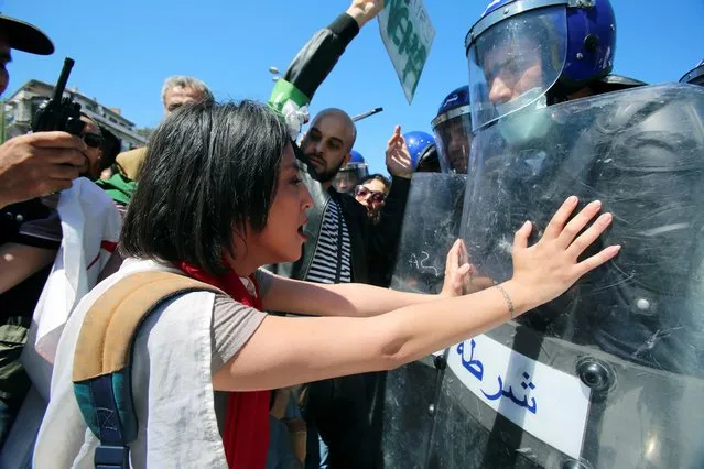 Police officers prevent demonstrators from marching during a May Day protest on Labour Day in Algiers, Algeria on May 1, 2019. (Photo by Ramzi Boudina/Reuters)