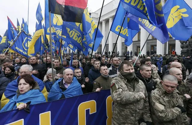 Activists of nationalist groups and their supporters take part in the so-called March of Dignity, marking the third anniversary of the 2014 Ukrainian pro-European Union (EU) mass protests, in Kiev, Ukraine, February 22, 2017. (Photo by Valentyn Ogirenko/Reuters)
