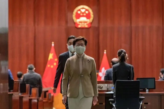 Hong Kong Chief Executive Carrie Lam leaves the Legislative Council main chamber after a oath-swearing ceremony on January 3, 2022 in Hong Kong, China. Hong Kong's Legislative Council is welcoming new members at a ceremony today, following a revamp of the electoral system by Beijing to ensure only “patriots” hold political power. (Photo by Anthony Kwan/Getty Images)