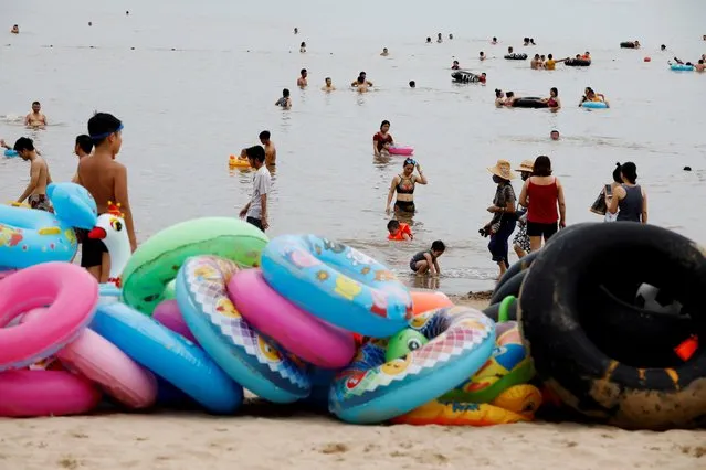 People play on the Do Son beach in Hai Phong city, Vietnam on July 11, 2019. (Photo by Reuters/Kham)