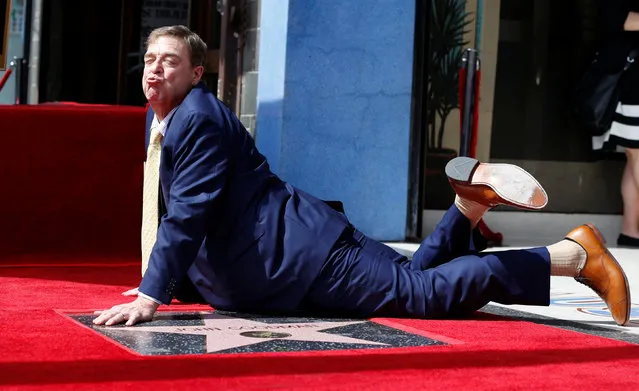 Actor John Goodman poses on his star after it was unveiled on the Hollywood Walk of Fame in Los Angeles, California U.S., March 10, 2017. (Photo by Mario Anzuoni/Reuters)