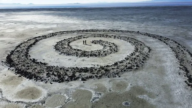 The Great Salt Lake is shown in the background of the earthwork Spiral Jetty by Robert Smithson Tuesday, February 1, 2022, on northeastern shore of the Great Salt Lake near Rozel Point in Utah. Last year the Great Salt Lake matched a 170-year record low and kept dropping, hitting a new low of 4,190.2 feet (1,277.2 meters) in October. (Photo by Rick Bowmer/AP Photo)