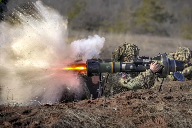 A Ukrainian serviceman fires an NLAW anti-tank weapon during an exercise in the Joint Forces Operation, in the Donetsk region, eastern Ukraine, Tuesday, February 15, 2022. While the U.S. warns that Russia could invade Ukraine any day, the drumbeat of war is all but unheard in Moscow, where pundits and ordinary people alike don't expect President Vladimir Putin to launch an attack on its ex-Soviet neighbor. (Photo by Vadim Ghirda/AP Photo)