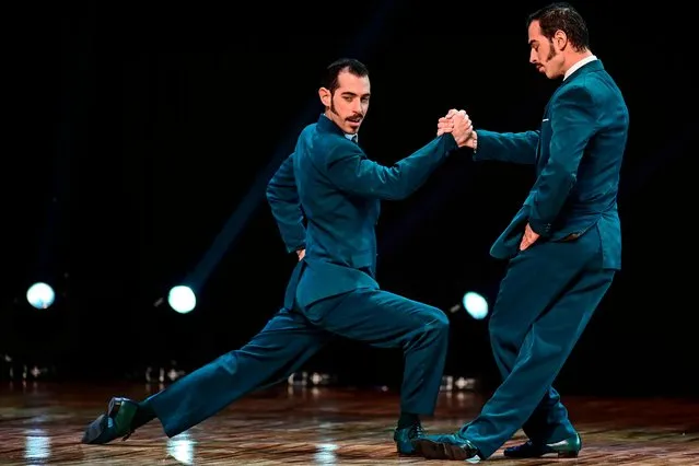 Argentinian twin dancers Nicolas Filipeli and German Filipeli perform during the Tango Stage final competition at the Tango Dance World Championship in Buenos Aires on August 21, 2019. (Photo by Ronaldo Schemidt/AFP Photo)