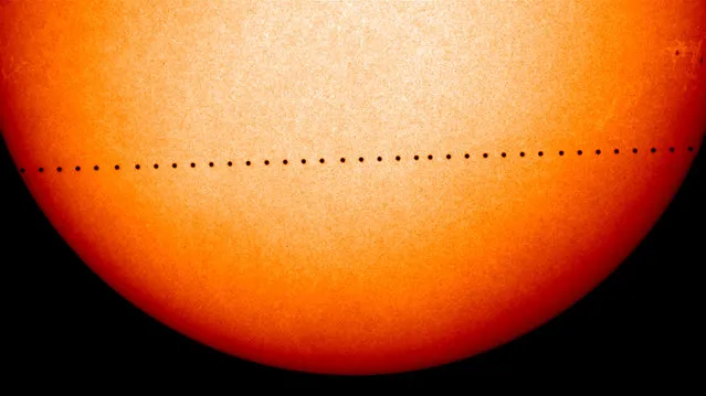 This composite image of observations by NASA and the ESA's Solar and Heliospheric Observatory shows the path of Mercury during its November 2006 transit. On Monday, May 9, 2016, the solar system's smallest, innermost planet will resemble a black dot as it passes in front of the Sun. NASA says the event occurs only about 13 times a century. (Photo by Solar and Heliospheric Observatory/NASA/ESA via AP Photo)