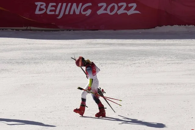 Mikaela Shiffrin of the United States leaves the finish area after racing in a semifinal of the mixed team parallel skiing event at the 2022 Winter Olympics, Sunday, February 20, 2022, in the Yanqing district of Beijing. (Photo by Luca Bruno/AP Photo)