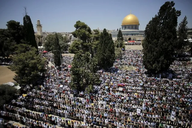 Palestinian men pray on the fourth Friday of the holy month of Ramadan at the compound known to Muslims as the Noble Sanctuary and to Jews as Temple Mount, in Jerusalem's Old City July 10, 2015. (Photo by Ammar Awad/Reuters)