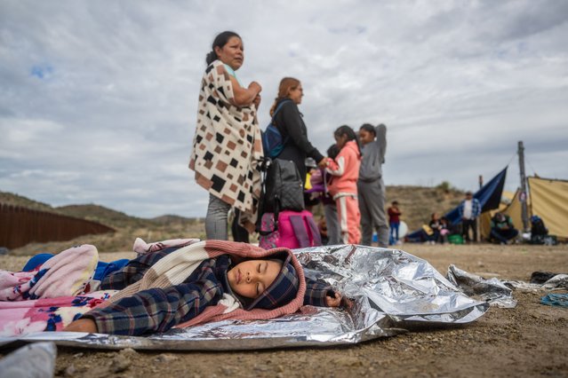 Mexican migrant Mariano Marquez, 5, sleeps on the ground while waiting for his family to be apprehended by U.S. Customs and Border protection officers after crossing over into the U.S. on June 25, 2024 in Ruby, Arizona. This group of migrants, mostly from South of Central America, crossed over into the U.S. and waited together alone throughout the night for more than 4 hours before border patrol arrived. President Joe Biden has announced an immigration relief plan, which promises a path to citizenship for approximately 500,000 undocumented immigrants married to or adopted by U.S. citizens. Day's after Biden's announcement, Republican presidential candidate, former U.S. President Donald Trump announced to a podcast host that he would solidify green cards for foreign nationals who've received a U.S. college diploma. (Photo by Brandon Bell/Getty Images)