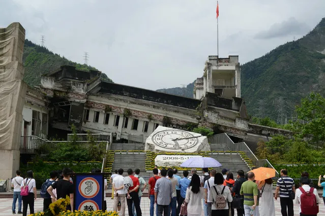 People visit Xuankou Middle School, a memorial site of the 2008 Sichuan earthquake, a day before the ninth anniversary of the earthquake, in Yingxiu town, Wenchuan county, Sichuan province, China May 11, 2017. (Photo by Reuters/Stringer)