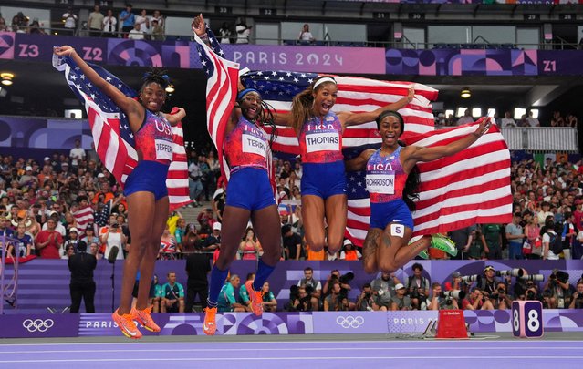 US' Melissa Jefferson, Twanisha Terry, Gabrielle Thomas and Sha'Carri Richardson celebrate after winning the women's 4x100m relay final of the athletics event at the Paris 2024 Olympic Games at Stade de France in Saint-Denis, north of Paris, on August 9, 2024. (Photo by Aleksandra Szmigiel/Reuters)