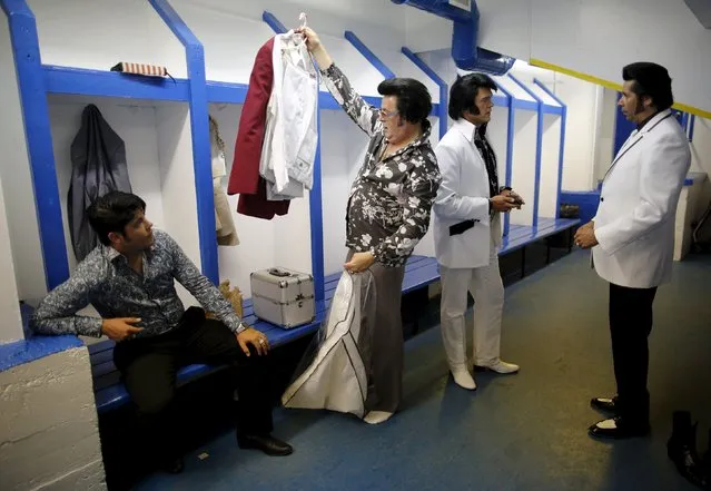Elvis Presley tribute artists (L-R) Richard Wolfe of Hamilton, Ontario, Doug McKenzie of Tavistock, Ontario, Corny Rempel of Steinbach, Manitoba and John Cigan of Pickering, Ontario prepare in a dressing room for a gospel talent contest during the four-day Collingwood Elvis Festival in Collingwood, Ontario July 26, 2015. (Photo by Chris Helgren/Reuters)