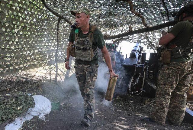 Dmytro, a member of the 15th Brigade of the Ukrainian National Guard, discards a spent shell casing after firing onto Russian positions near Pokrovsk on September 5, 2024. The city is a key logistical hub for the Ukrainian military. The Russian Defense Ministry reported on September 8 that its forces had captured the town of Novohrodivka, some 12 kilometers from Pokrovsk. (Photo by Serhiy Nuzhnenko/Radio Free Europe/Radio Liberty)