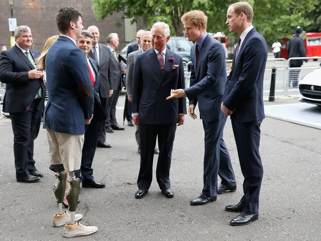 Prince Charles, Prince of Wales, Prince William, Duke of Cambridge and Prince Harry chat to Captain Anthony Harris, the founder Race2Recovery as they attend the BITC Annual Responsible Business Awards Gala at Royal Albert Hall on July 8, 2014 in London, England. (Photo by Chris Jackson/Getty Images)