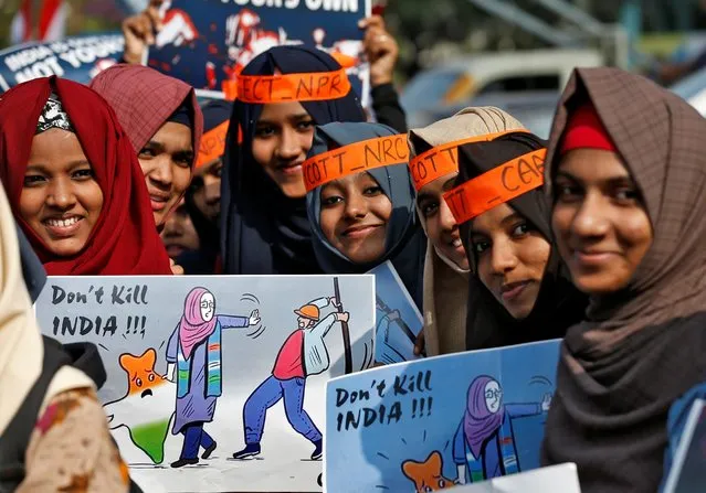 Demonstrators pose before taking part in a protest rally against a new citizenship law, in Kochi, India, January 14, 2020. (Photo by Sivaram V/Reuters)