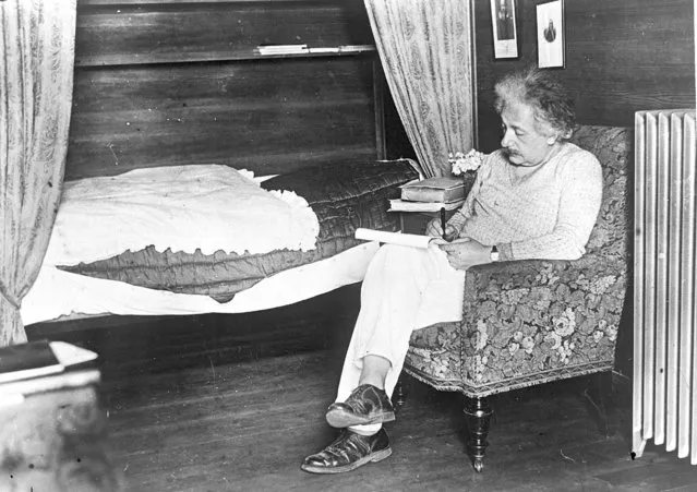 Professor Albert Einstein, the famous relativity author, at work in his simple country cottage ay Caputh, near Berlin, July 15, 1931. (Photo by AP Photo)